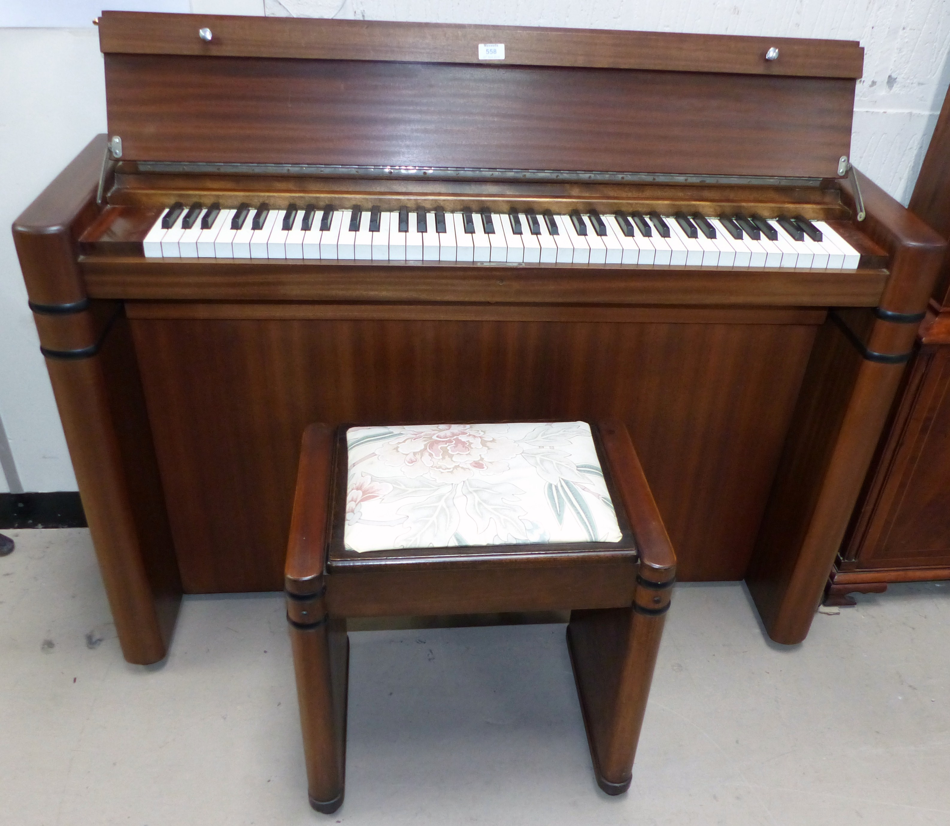 An Eavestaff mini piano in Art Deco style sapele case with stool