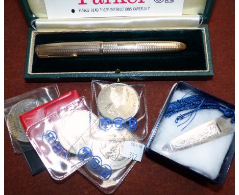 A 9 carat hallmarked gold engine turned Parker fountain pen, boxed; a silver bookmark; 6 modern commemorative crowns