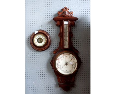 A banjo style wall barometer and another barometer.     