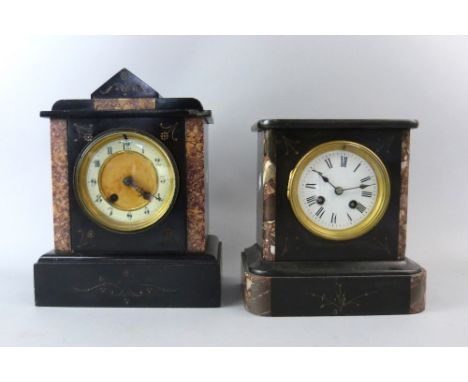 Two slate mantel clocks .     