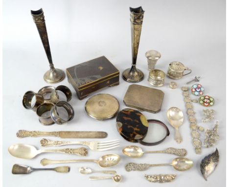 Various silver items including a pair of vases, caddy spoon, compact, spoons, napkin rings, tortoishell folding magnifying gl