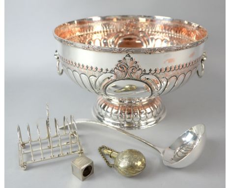 Silver toast rack, pepper pot, mustard pot and a silver plated punch bowl and ladle, and a Moroccan perfume bottle..     