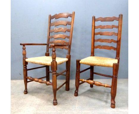 Set of seven oak ladder back dining chairs .     