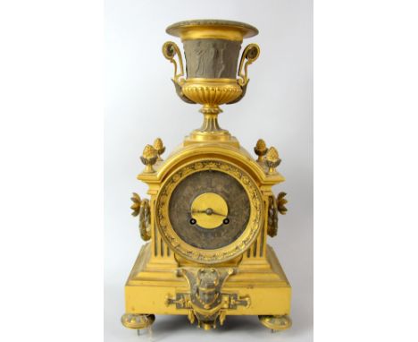 Gilt metal mantel clock .     