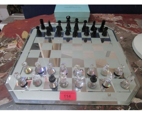 A Swarovski glass chess set and board 