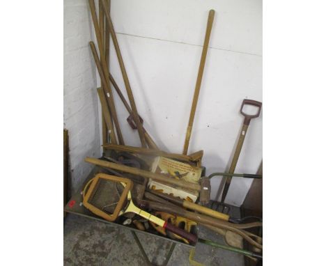 A selection of mainly tools to include saws, gardening tools, wheel barrow and other items 