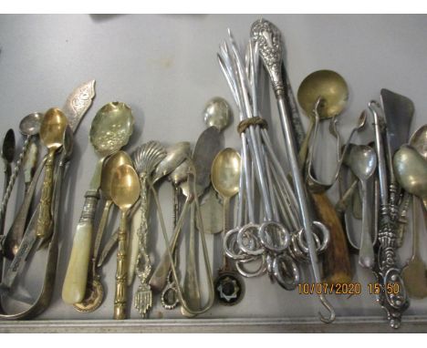 A selection of silver and silver plated flatware to include three Blackheath Harriers silver spoons, Victorian sugar tons and
