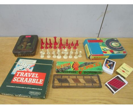 A selection of vintage games to include a 19th century bone chess set in a vintage tin 