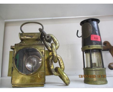 An early 20th century miners lamp no 548, together with an early 20th century dependence lamp holder and chain by J &amp; R O