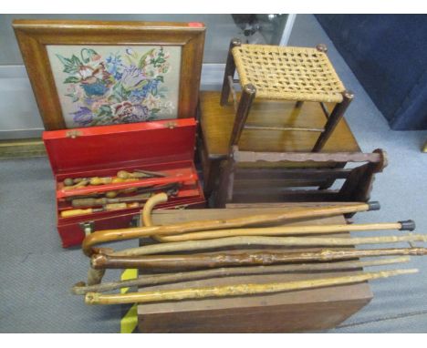 A mixed lot to include walking sticks, vintage tools, firescreen, footstool, magazine rack, vintage box, a hinged topped low 