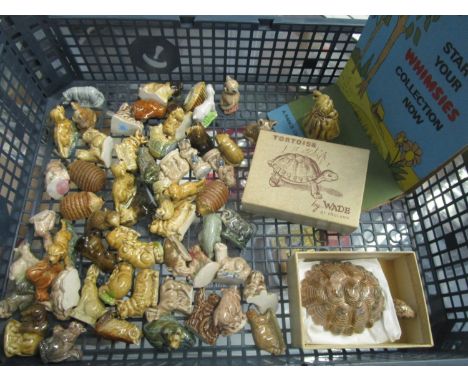 A collection of Wade Whimsies to include a boxed tortoise and shop cardboard display 
