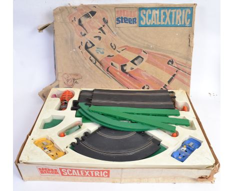 SCALEXTRIC: An original vintage Scalextric ' You Steer ' racing set, within the original box. Appears complete (minus transfo