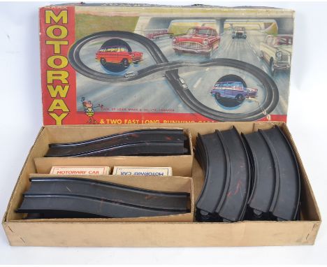 MARX MOTORWAY: An original vintage Marx Toys ' Motorway ' racing set, with track. Appears complete with both clockwork tinpla