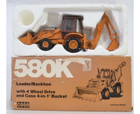 CASE 580K DIGGER: An original 1:35 scale diecast model CASE 580K Loader digger / tractor. Within the original box. 