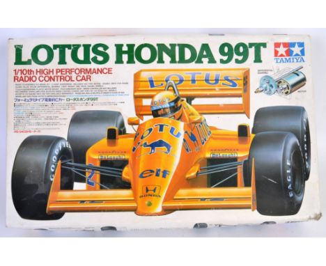 TAMIYA: An original vintage Tamiya 1:10 scale model car kit - Lotus Honda 99T - appears to be complete and unused, within the