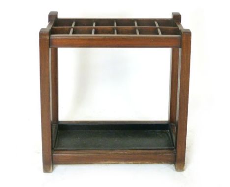 A mahogany stick stand, late 19th century, with twelve divisions and wrought iron drip tray, h. 71 cm x w. 69 cm CONDITION RE