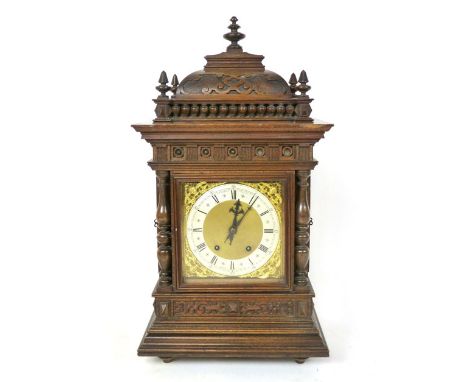 An oak cased mantle clock, circa. 1900, the 7 1/2" silvered chapter ring inscribed 'J W Benson, Ludgate Hill, London, German 