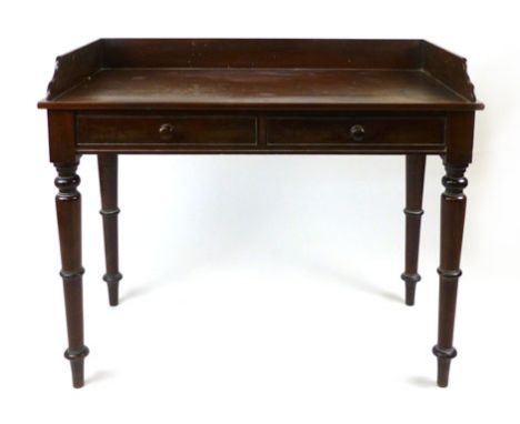 A Victorian mahogany writing table, with three quarter gallery and a pair of frieze drawers. h. 88 cm, w. 106 cm. CONDITION R
