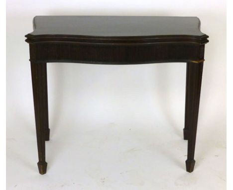 A mahogany fold out card table of serpentine form with baize lined interior, reeded frieze. w. 91cm. CONDITION REPORT: Surfac