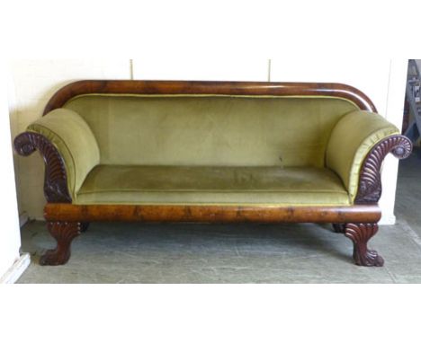 William IV mahogany scroll arm sofa, circa 1830, with stylized floral carving to the arms raised on substantial lion paw feet