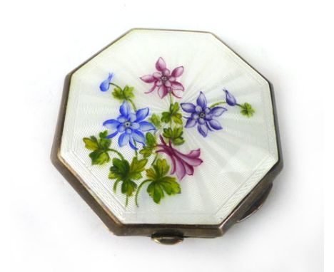 A white metal and enamelled compact with floral decoration, back with engine turned decoration CONDITION REPORT: generally go
