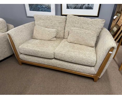 Ercol oatmeal upholstered three piece suite with accompanying foot stool