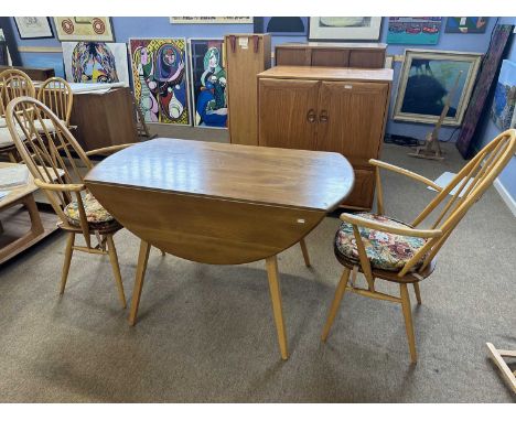 Ercol light elm drop leaf dining table together with two stick back carver chairs
