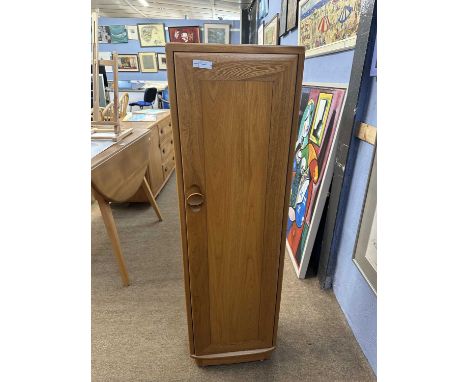 Ercol light elm narrow cupboard with internal CD racks, 35cm wide, 117cm high