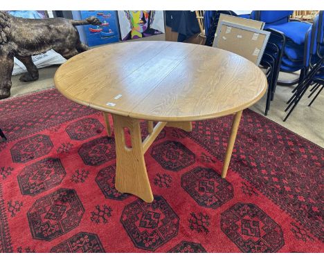Narrow Ercol drop leaf light elm dining table, 107cm wide