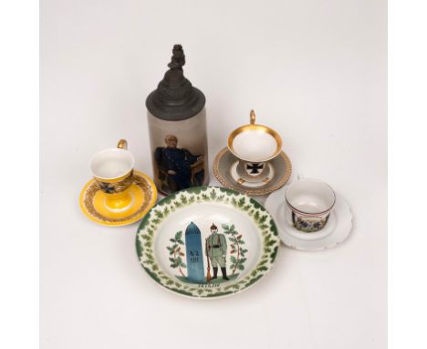 A collection WWI Imperial German items, including beer stein, two matching cups and saucers, converted water bottle photo fra
