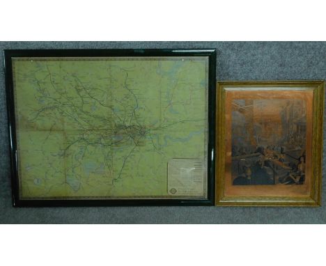 A framed and glazed vintage tube and train map of London and a framed copper plate engraving after Hogarth of Gin Lane. 50x65