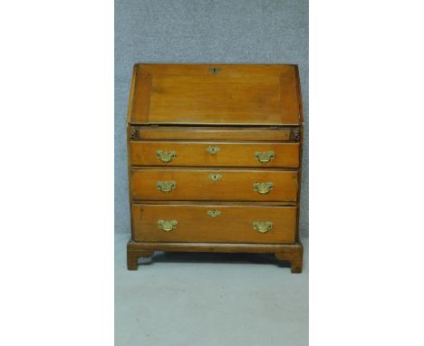 A Georgian mahogany bureau with three large drawers and inside fittings, raised on bracket feet. H.107 W.94 D.54cm 