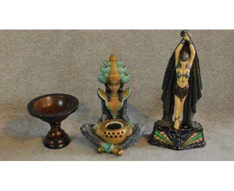 An Art Deco resin statue of a dancing girl on a marbled glass base along with a wooden pedestal bowl and painted ceramic Thai