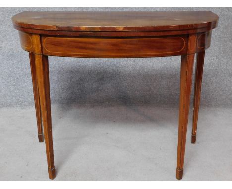 An Georgian mahogany and inlaid foldover top card table, raised on square tapering supports. H.72 W.92 D.88cm 