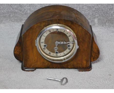 An antique walnut clock with white enamel face and black Roman numerals, stamped made in England to the back. H.23 W.35 D.15c