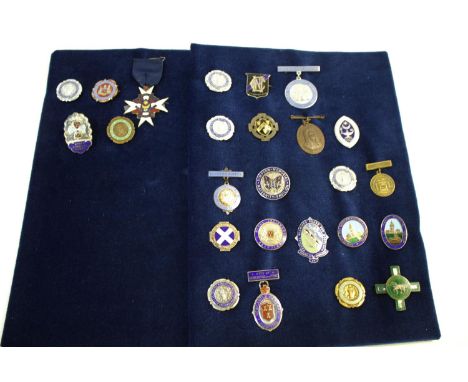 NURSING BADGES 25 various badges on two cards, including a silver and enamel badge (Finis Coronat Opus), Tuberculosis Nursing