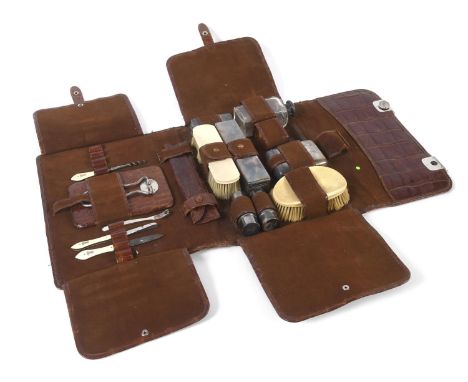 CROCODILE SKIN DRESSING CASE &amp; SILVER FITTINGS a crocodile skin case with folding flaps, with various fittings including 