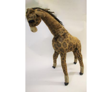 LARGE STEIFF GIRAFFE a large toy giraffe with bushy eyelashes and padded feet, with yellow Steiff Original label and button. 