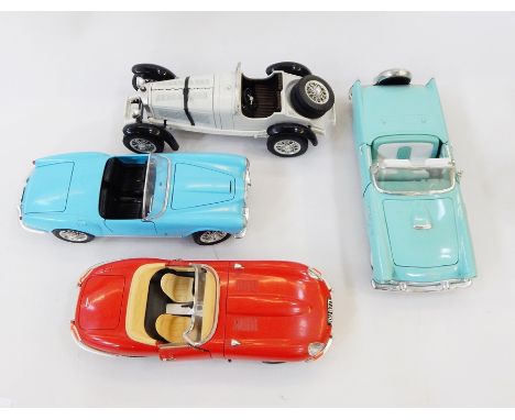 A Burago model of a Jaguar E-type 1961, 1:18 scale, another of a 1955 spider, a Mercedes Benz and one other toy car model 