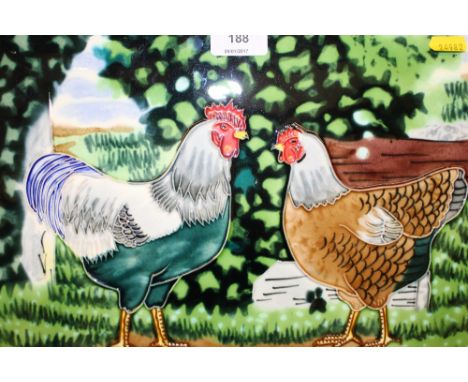 A pottery glazed wall tile depicting two chickens