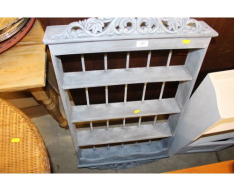 A blue painted spice rack