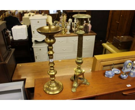 A large brass pricket stick; and a brass table lamp base