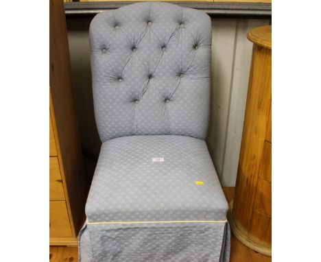 A blue upholstered button back nursing chair 