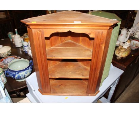 A stripped pine hanging corner wall shelf 