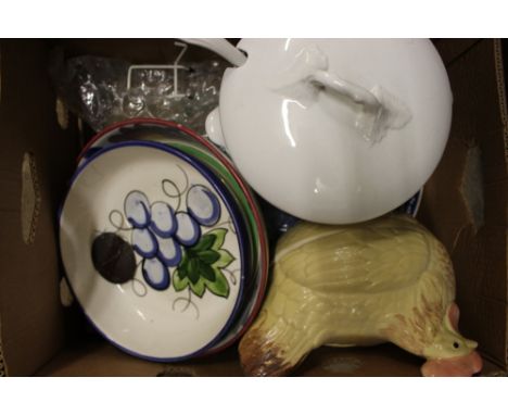 A box containing a white glazed soup tureen and ladle; an egg tureen; pottery bowls etc.