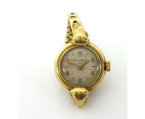Jaeger- le-Coultre. A 9ct gold manual wind ladies wristwatch, London 1956, the movement 1183932, to a brick pattern bracelet,