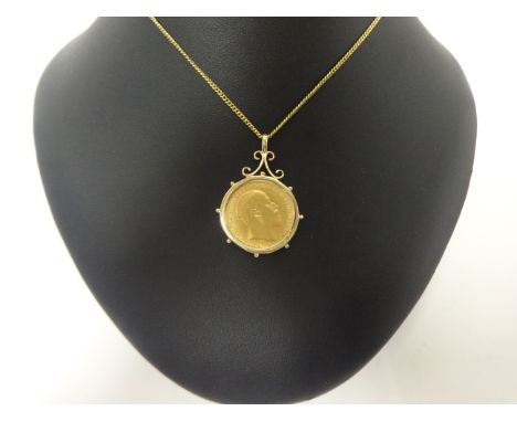 A 1910 sovereign mounted pendant, set in a loose mount, chain, gross weight 13.9 grams.