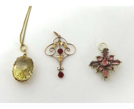 A gold mounted citrine pendant, claw set with a mixed cut stone, chain, a Georgian foiled rock crystal set cruciform brooch a