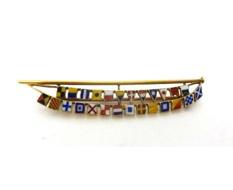 An Edwardian 15ct gold and enamel flag brooch, the mast hoisting the letters of the alphabet, length 5.5 cm, weight 5 grams.