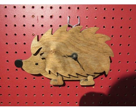 A Welsh (West Glamorgan Pineneedles crafts) wooden wall clock, in the form of a hedgehog 